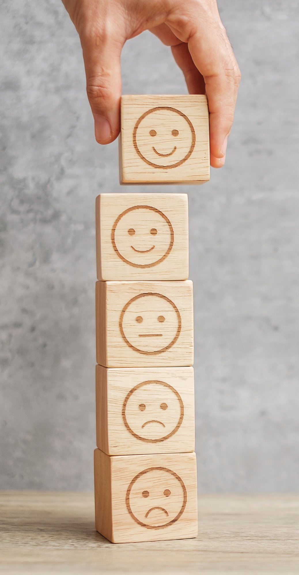emotion-face-symbol-on-wooden-blocks-mood-servic-2026-01-09-00-41-48-utc